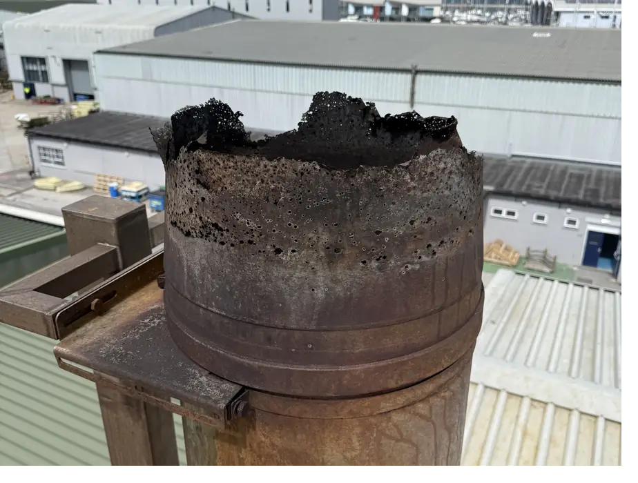 Biomass flue terminal perforated by corrosion